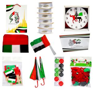 UAE National Day Celebration Combo Pack – Table Clock, Color Light (1 Box), Printed Balloons (1 Pkt), Flag Toothpicks (2 Pkts), Large UAE Flags 60x90 cm (3 Pcs), Plastic Stick Flags 20x30 cm (12 Pcs), Gift Bags 34×25×12 cm (12 Pcs), White Ribbon 25 yd (2 Rolls), Color Umbrella Set (2 Pcs), Chocolate Gift Boxes (2 Pcs)
